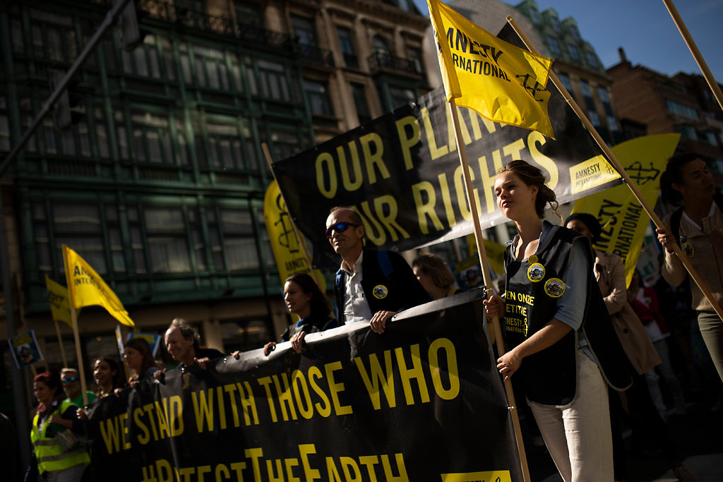 Thousands march during a climate protest in Brussels